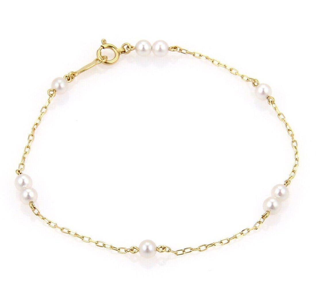 Beaded Akoya Pearl and 14k Yellow Gold Chain Bracelet by Mikimoto: Beaded Akoya Pearl and 14k Yellow Gold Chain Bracelet by Mikimoto This vintage Mikimoto bracelet features 3.5mm Akoya pearls intricately set along a chain link design crafted from 14k yellow gold. Sig
