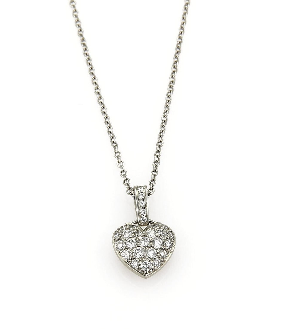 Diamond Heart Pendant Necklace in Platinum by Tiffany & Co. French Pave Design: Diamond Heart Pendant Necklace in Platinum by Tiffany & Co. French Pave Design This necklace features a heart-shaped pendant crafted in platinum and set with approximately 0.20 carats of natural diamo