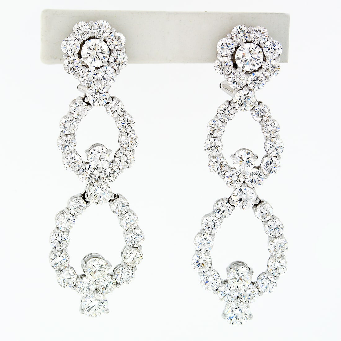Platinum 14.92ctw VVS G Diamond Long Dangle Drop Earrings: Platinum 14.92ctw VVS G Diamond Long Dangle Drop Earrings These exquisite long dangle drop earrings are crafted from solid platinum and showcase approximately 14.92 carats of very fine quality round b