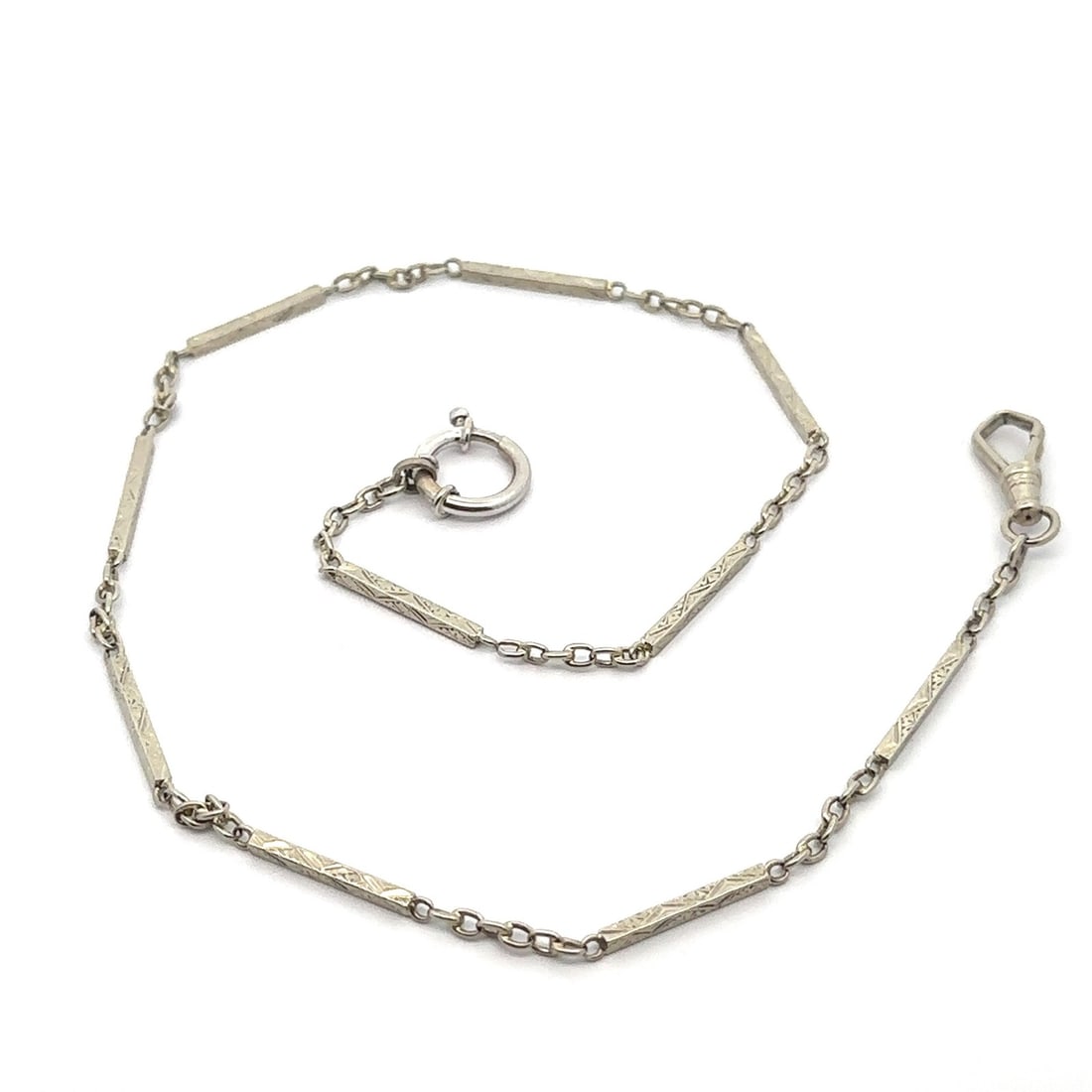 Art Deco 15in White Gold Engraved Boxy Pocket Watch Chain Necklace: Art Deco 15in White Gold Engraved Boxy Pocket Watch Chain Necklace This exquisite Art Deco necklace showcases a beautifully crafted pocket watch chain design, made from solid 13k-14k white gold. The 1