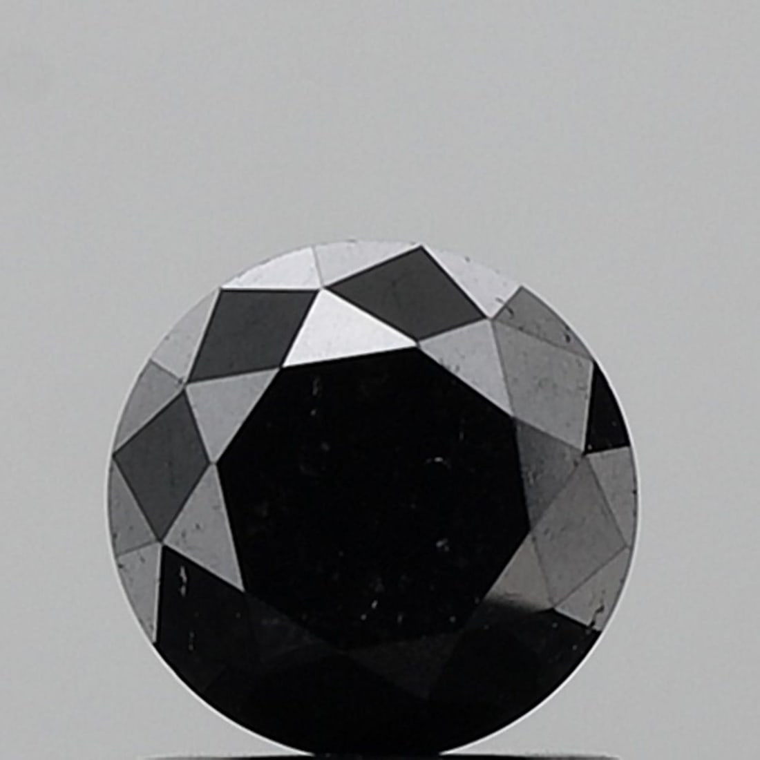 Loose Diamond - ROUND 1.26ct Fancy Black VVS2: Loose Diamond - ROUND 1.26ct Fancy Black VVS2 Source: Natural Shape: ROUND Carats: 1.26 Color: Fancy Black Certification: NONE Video: