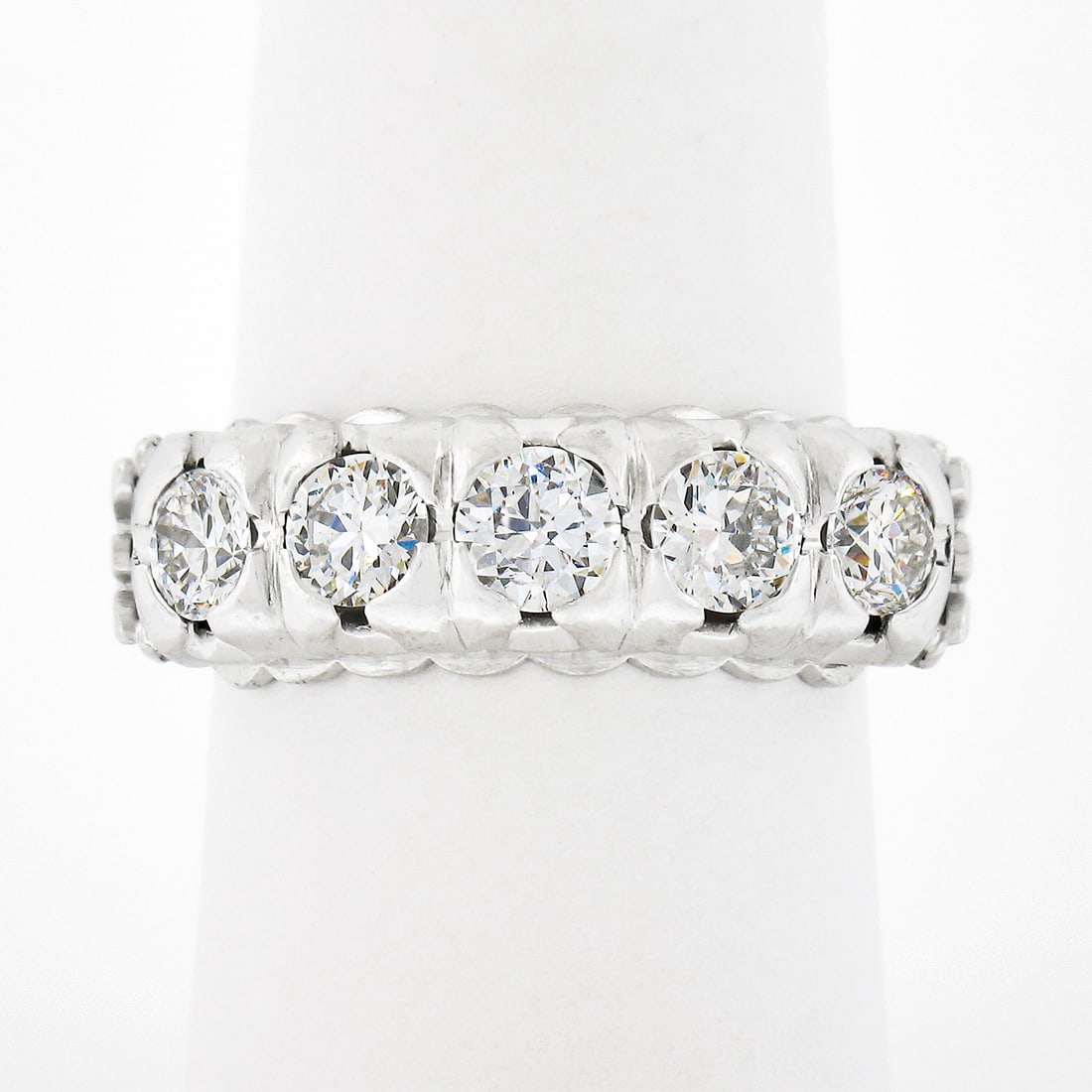 Vintage Platinum 1.30ctw 5 Stone Fishtail Pave Set Diamond Band Ring: Vintage Platinum 1.30ctw 5 Stone Fishtail Pave Set Diamond Band Ring This stunning vintage band ring from the 1940s is crafted from solid platinum and features a magnificent display of five old transi