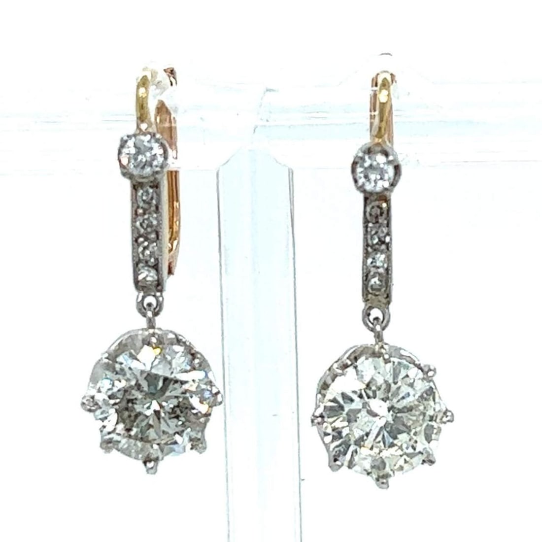Platinum 18K Yellow Gold 3.97 Ct. Diamond Earrings: Platinum 18K Yellow Gold 3.97 Ct. Diamond Earrings Elevate your elegance with these stunning Platinum and 18K Yellow Gold Diamond Earrings. Featuring a total diamond weight of 3.97 carats, these earri