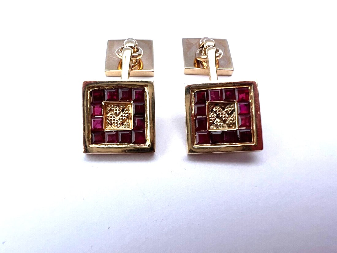14K Yellow Gold Ruby Cufflinks Baguette Cut French Design: 14K Yellow Gold Ruby Cufflinks Baguette Cut French Design Elevate your formal attire with this exquisite pair of cufflinks crafted from 14K yellow gold and adorned with stunning rubies. Each cufflink