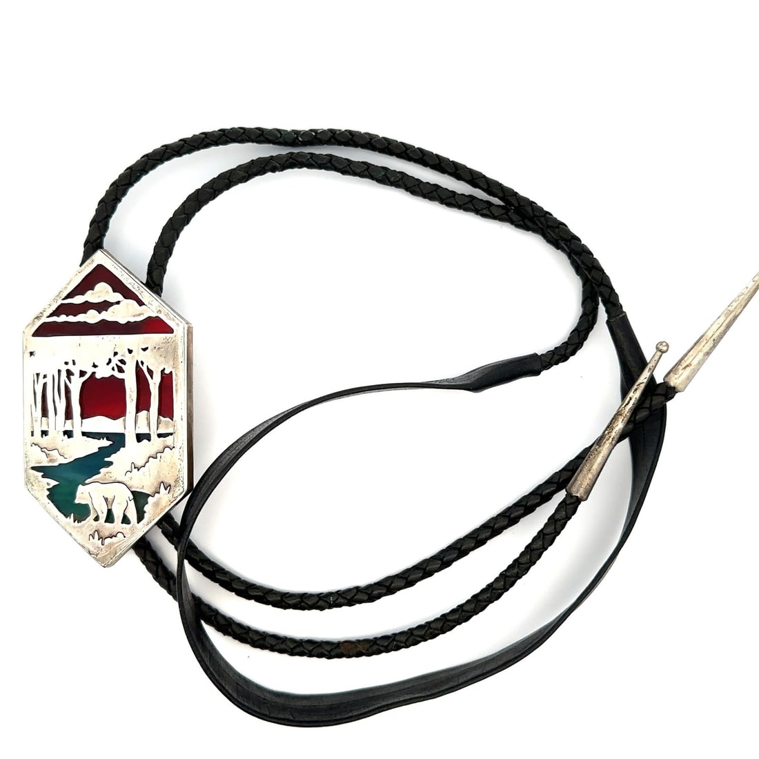 Sterling Silver and Stained Glass Bear Lake Motif Leather Bolo Tie: Sterling Silver and Stained Glass Bear Lake Motif Leather Bolo Tie This bolo tie features a distinctive design with a Bear Lake forest motif crafted from stained glass and sterling silver. The centerp