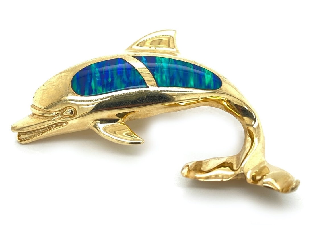 Dolphin Pendant with Opal Inlay in 14k Yellow Gold Charm: Dolphin Pendant with Opal Inlay in 14k Yellow Gold Charm This opal inlay dolphin charm pendant is crafted from 14k yellow gold and features a detailed dolphin design with an opal inlay accent. The pen