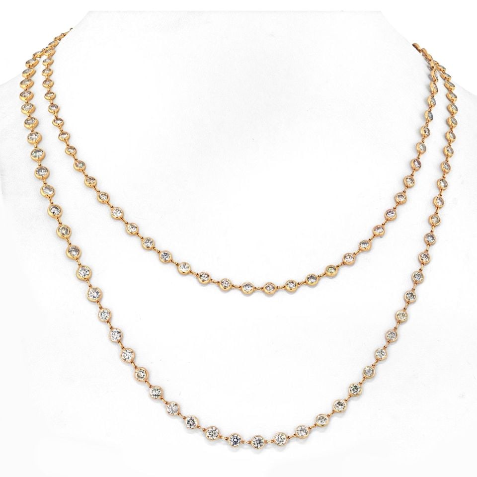 18K Yellow Gold 34 Carat Diamonds By The Yard Necklace 43 Inch: 18K Yellow Gold 34 Carat Diamonds By The Yard Necklace 43 Inch This stunning necklace is crafted from 18K yellow gold and features an impressive total diamond weight of approximately 34.07 carats. Mea