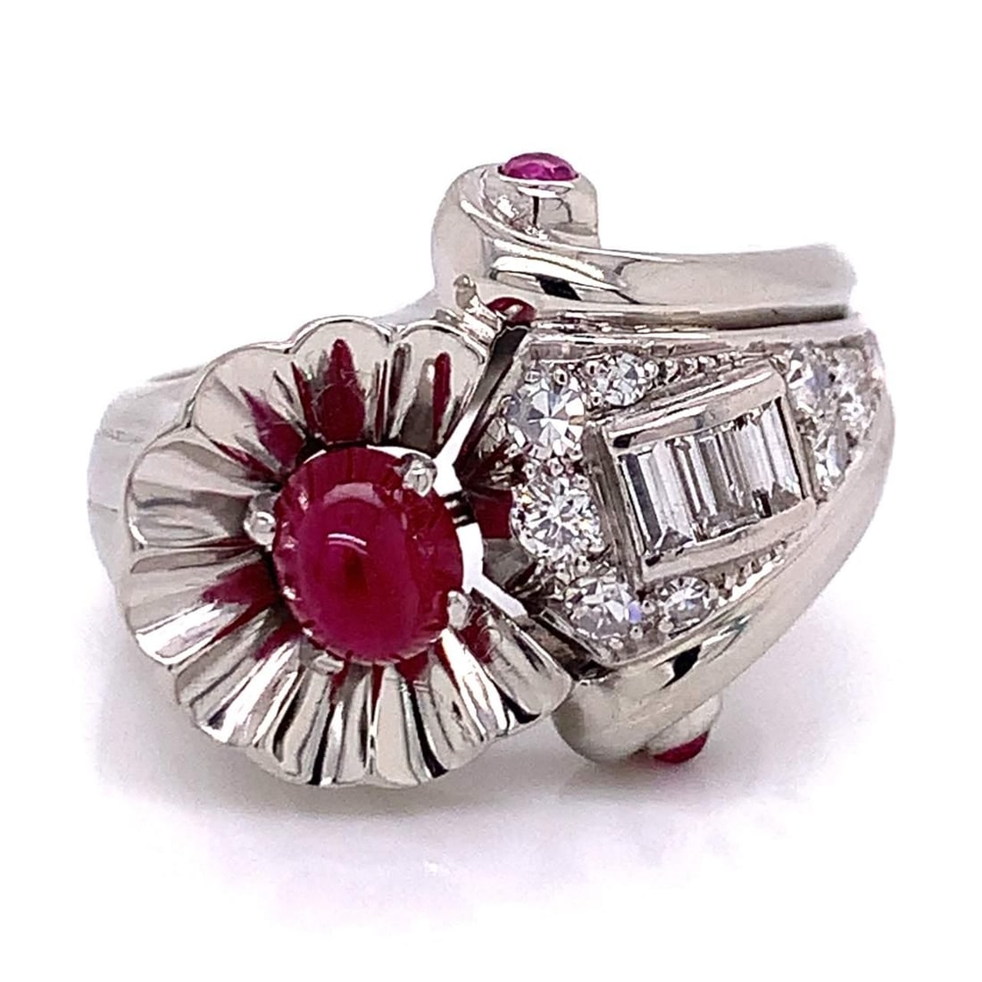 Art Deco 18K White Gold Ruby Diamond Ring 0.60 Ct Ruby 0.50 Ct Diamonds: Art Deco 18K White Gold Ruby Diamond Ring 0.60 Ct Ruby 0.50 Ct Diamonds This exquisite Art Deco ring showcases a stunning 18K white gold design adorned with a captivating ruby and diamonds. At its cen