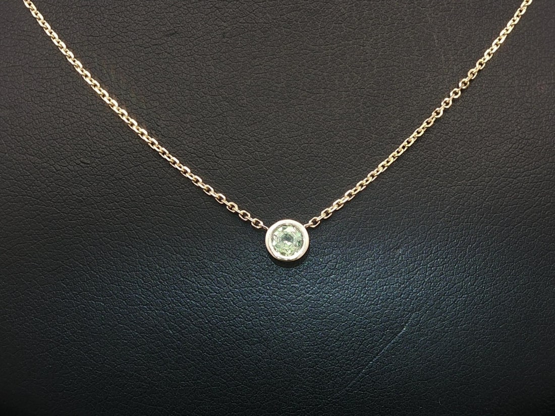 Natural Alexandrite Solitaire Pendant in 14k Yellow Gold 0.24 Carat: Natural Alexandrite Solitaire Pendant in 14k Yellow Gold 0.24 Carat This pendant necklace features a 0.24 carat natural Brazilian color change alexandrite set in a round brilliant cut and secured in a