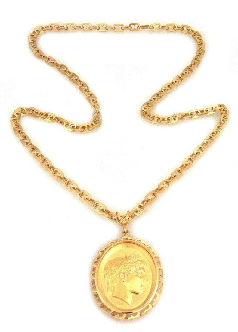 18k Yellow Gold Oval Woman Cameo Pendant Necklace Signed by Wachler 26 Inch: 18k Yellow Gold Oval Woman Cameo Pendant Necklace Signed by Wachler 26 Inch This vintage necklace features a signed Wachler oval pendant with an embossed woman cameo design, crafted in 18k yellow gold