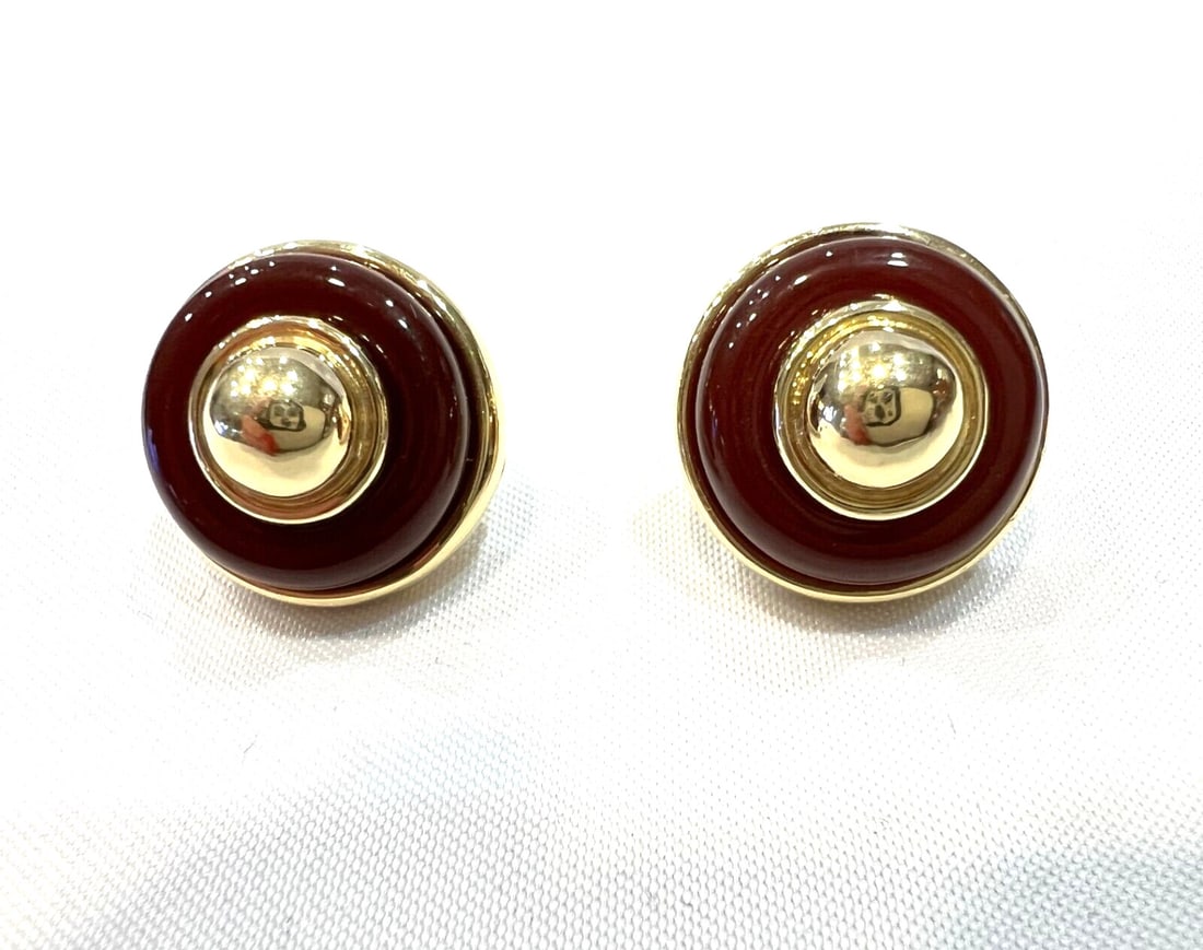 Tiffany & Co 18K Gold Carnelian Clip Stud Earrings with Box: Tiffany & Co 18K Gold Carnelian Clip Stud Earrings with Box This exquisite pair of earrings by Tiffany & Co. showcases a stunning combination of 18K yellow gold and vibrant carnelian stones. Originall