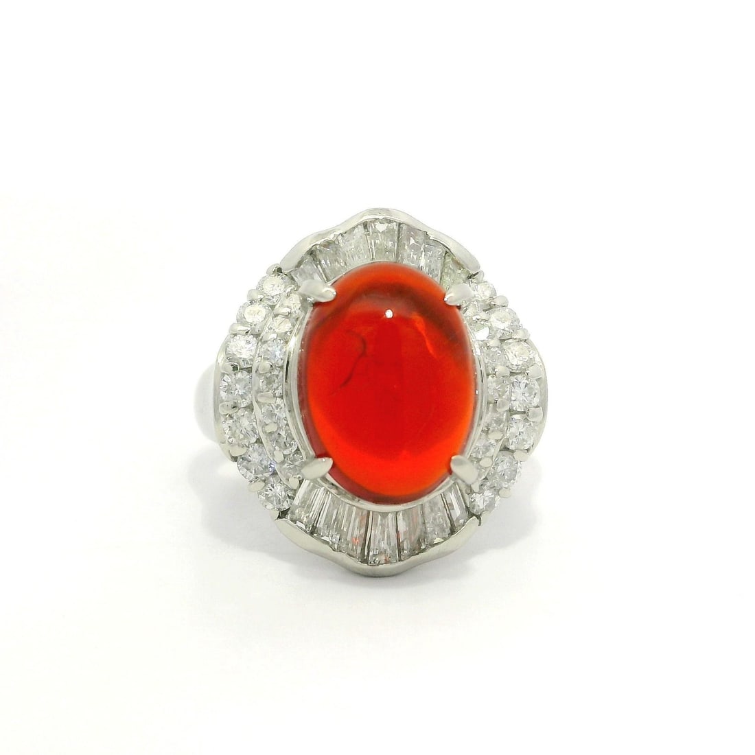 Platinum 3.68ct Fire Orange Opal Diamond Halo Cocktail Ring: Platinum 3.68ct Fire Orange Opal Diamond Halo Cocktail Ring This stunning cocktail ring features a captivating 3.68ct natural fire opal, showcasing a deep orange color in a high-quality oval cabochon