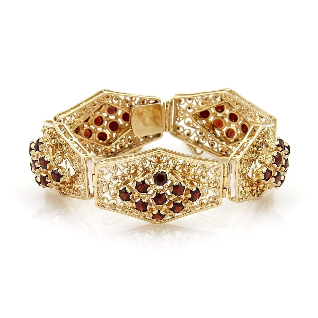 Vintage 14k Gold Floral Filigree Garnet Bracelet with Link Design: Vintage 14k Gold Floral Filigree Garnet Bracelet with Link Design This vintage link bracelet features an intricate filigree floral design crafted from 14k yellow gold and adorned with vibrant red garn