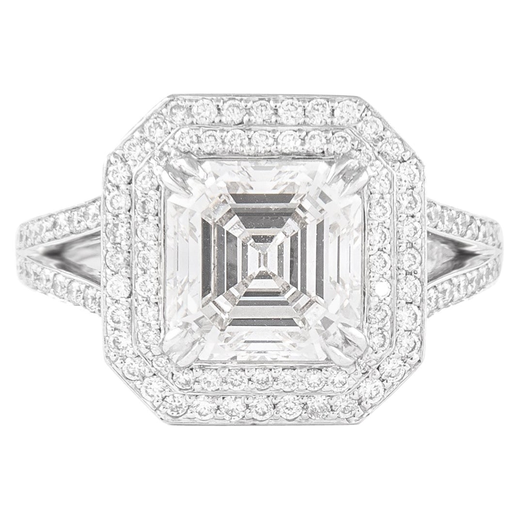 GIA 3.02ct Asscher Cut Diamond Double Halo Ring in 18k White Gold: GIA 3.02ct Asscher Cut Diamond Double Halo Ring in 18k White Gold This exquisite engagement ring features a stunning 3.02 carat Asscher cut diamond at its center, with a GIA certification confirming i