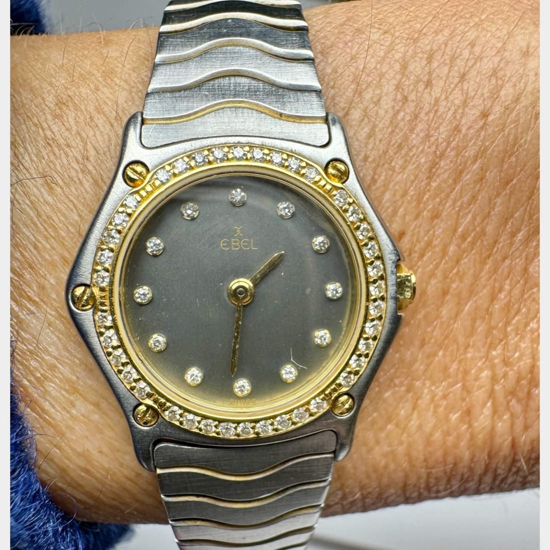 EBEL Wave 18K Gold Stainless Steel Diamond Watch Quartz: EBEL Wave 18K Gold Stainless Steel Diamond Watch Quartz The EBEL 18K & Stainless Steel Wave Watch features a stunning original diamond dial and bezel, elegantly combining 18K gold with stainless steel