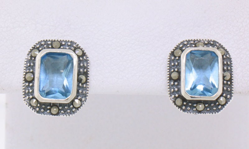 Marcasite Sterling Silver Blue Topaz Bezel Stud Earrings: Marcasite Sterling Silver Blue Topaz Bezel Stud Earrings Elevate your style with these exquisite Marcasite Sterling Silver Blue Topaz Bezel Stud Earrings. Crafted from solid sterling silver with a met