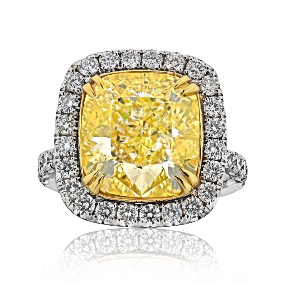 10.03 Carat GIA Fancy Intense Yellow Diamond Halo Ring: 10.03 Carat GIA Fancy Intense Yellow Diamond Halo Ring This exquisite Fancy Yellow Intense Cushion Cut Diamond Ring showcases a breathtaking 10.03-carat cushion-cut diamond, certified by GIA as Fancy