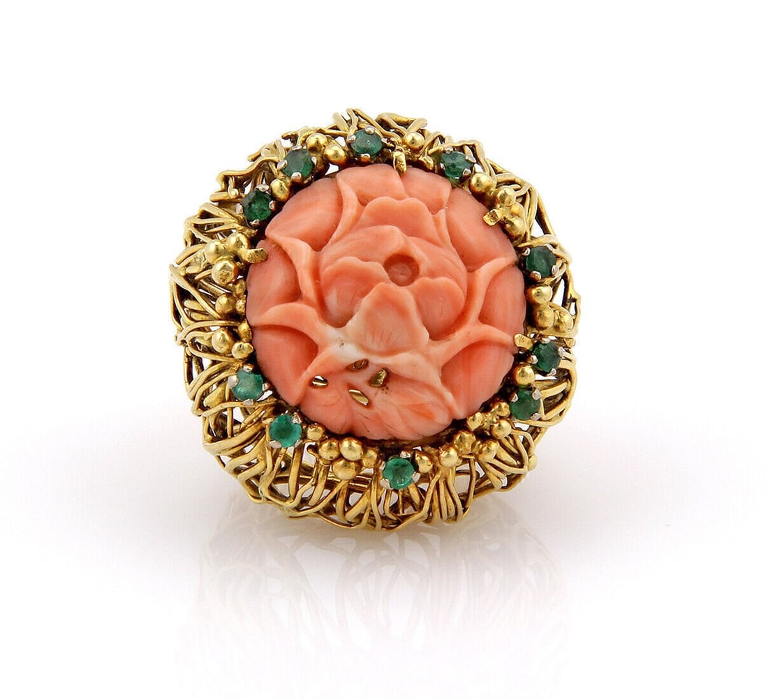 Vintage 14k Gold Flower Ring with Coral and Emerald Accents by J. Auen Size 6: Vintage 14k Gold Flower Ring with Coral and Emerald Accents by J. Auen Size 6 This vintage ring by J. Auen is crafted from 14k yellow gold and showcases a large flower design adorned with coral and em