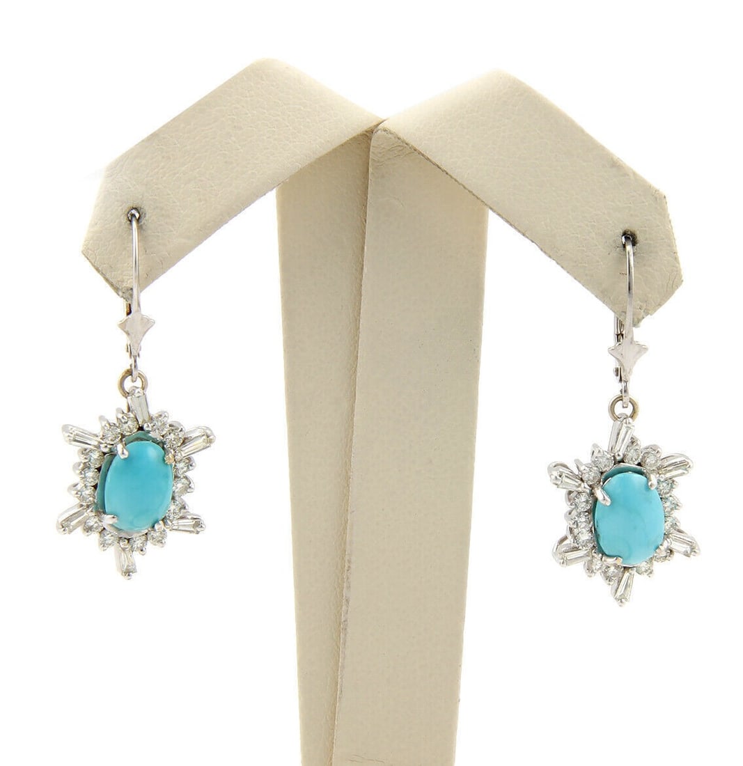 14k White Gold Dangle Earrings with Turquoise and Diamond Accents: 14k White Gold Dangle Earrings with Turquoise and Diamond Accents These dangle earrings feature turquoise gemstones and diamonds set in 14k white gold with a hook design. The combination of turquoise