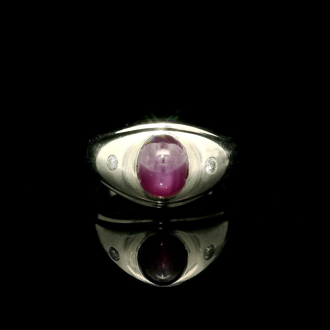 Vintage 18k White Gold 2ct Star Ruby Diamond Accent Ring: Vintage 18k White Gold 2ct Star Ruby Diamond Accent Ring This stunning vintage band ring showcases a beautiful 2-carat star ruby complemented by diamond accents, making it a perfect cocktail ring for