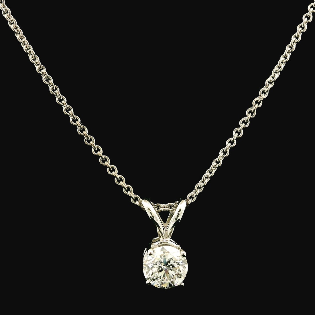 Classic 14k White Gold 0.40ct Diamond Pendant on 16 Inch Necklace: Classic 14k White Gold 0.40ct Diamond Pendant on 16 Inch Necklace This exquisite pendant features a stunning round brilliant cut diamond, weighing approximately 0.40 carats. The diamond is prong set a