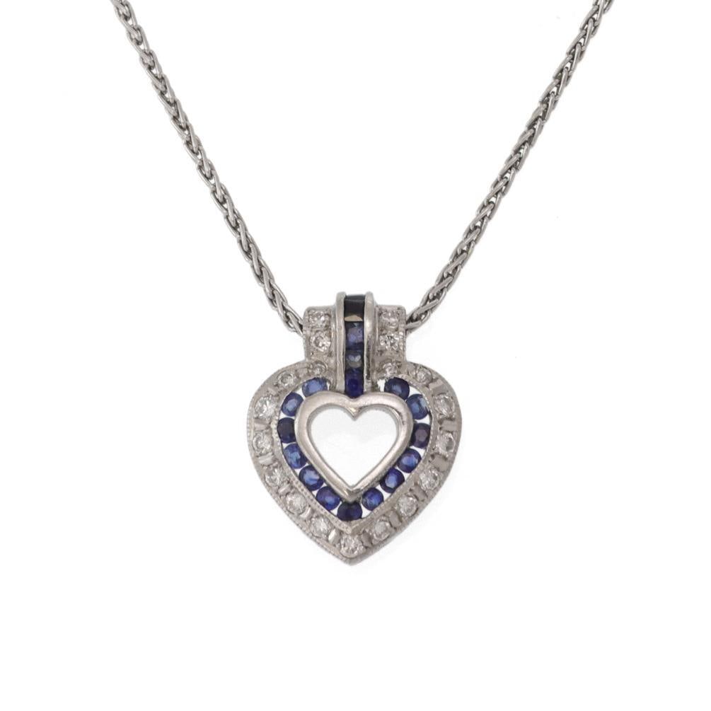 Platinum Diamond Sapphire Heart Pendant Necklace with Chain: Platinum Diamond Sapphire Heart Pendant Necklace with Chain This exquisite open heart pendant and chain necklace is crafted from durable platinum. The pendant showcases a beautifully designed open hea