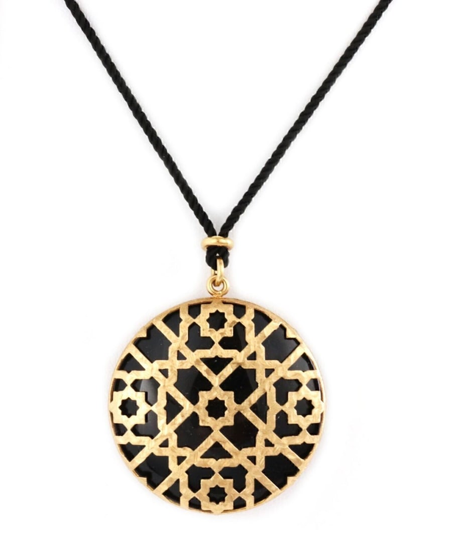 Picasso Marrakesh Onyx Floral Pendant Necklace in 18k Yellow Gold with Cord: Picasso Marrakesh Onyx Floral Pendant Necklace in 18k Yellow Gold with Cord This Tiffany & Co. Picasso Marrakesh pendant necklace features a striking onyx stone set within an 18k yellow gold floral mo