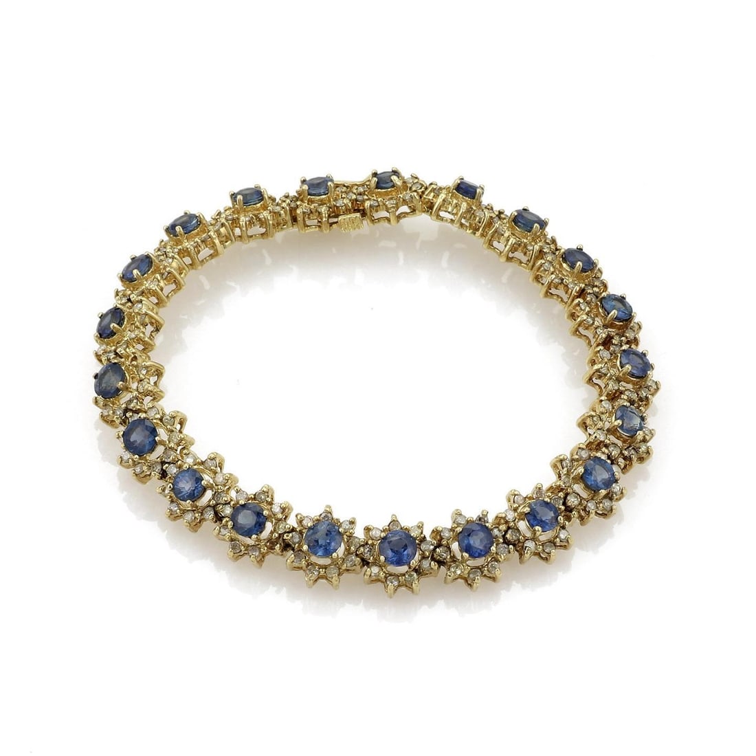 Estate 18k Yellow Gold Star Link Bracelet with Sapphire and Diamond: Estate 18k Yellow Gold Star Link Bracelet with Sapphire and Diamond This exquisite Estate bracelet showcases a stunning design crafted from 18k yellow gold with a polished finish. It features 21 star