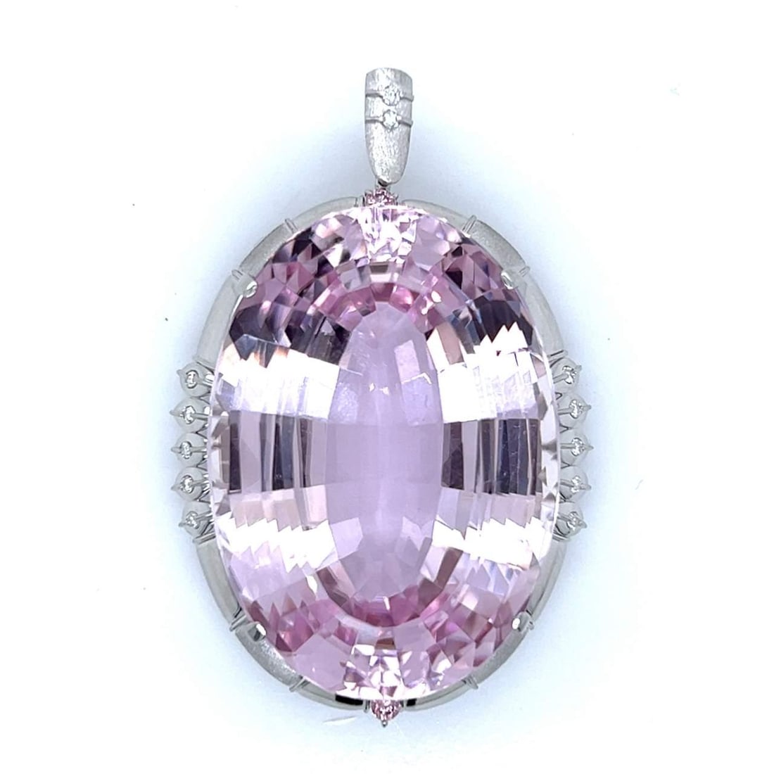 Platinum Kunzite 130.28 Ct Diamond Pendant with Chain: Platinum Kunzite 130.28 Ct Diamond Pendant with Chain This stunning Platinum pendant features a remarkable 130.28 Ct. Kunzite at its center, beautifully complemented by 0.26 Ct. of sparkling diamonds.