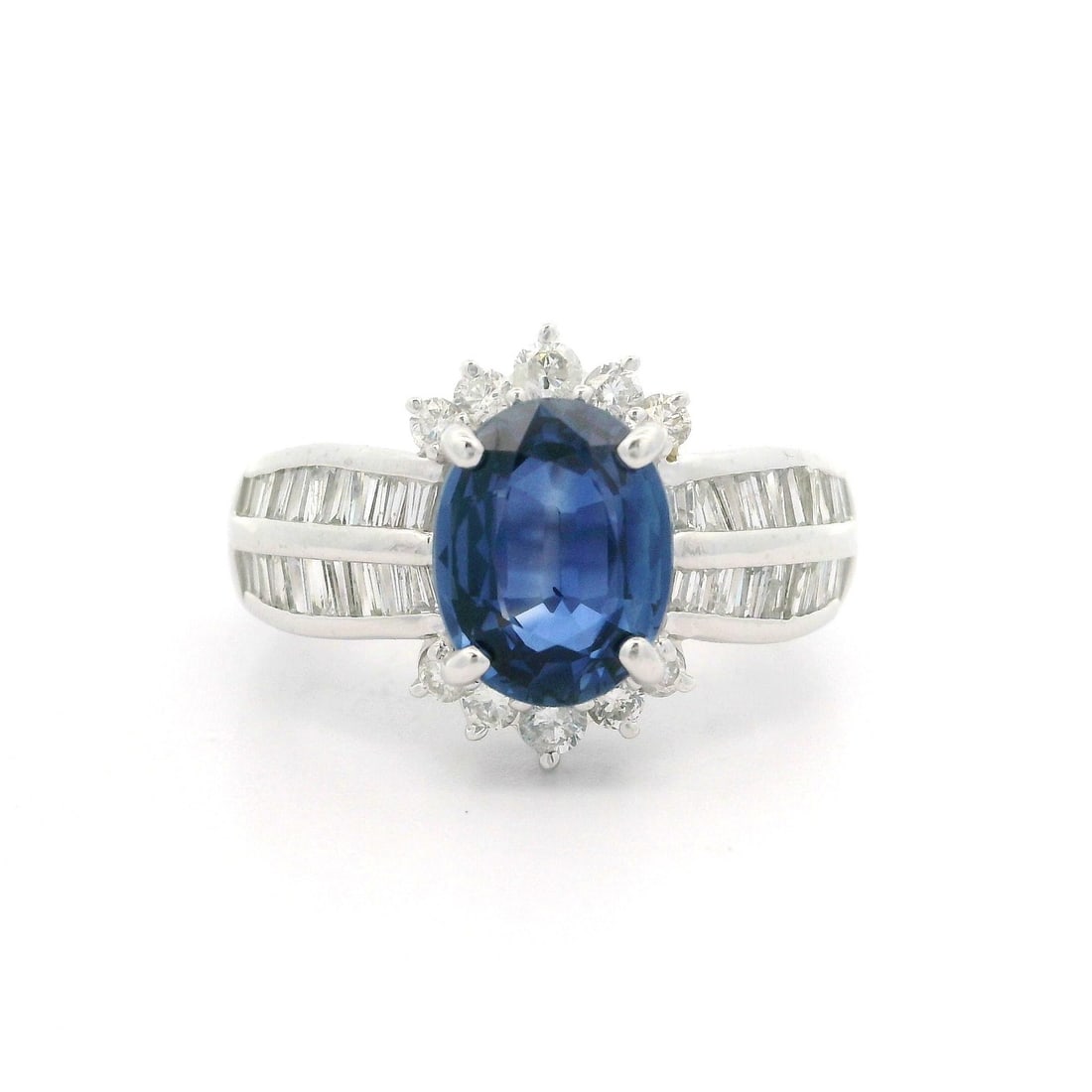 Platinum GIA Certified 3ctw Blue Oval Sapphire Diamond Floral Ring: Platinum GIA Certified 3ctw Blue Oval Sapphire Diamond Floral Ring This exquisite cocktail ring features a stunning natural oval sapphire, weighing 2.22ct, in a captivating blue hue. The sapphire is e