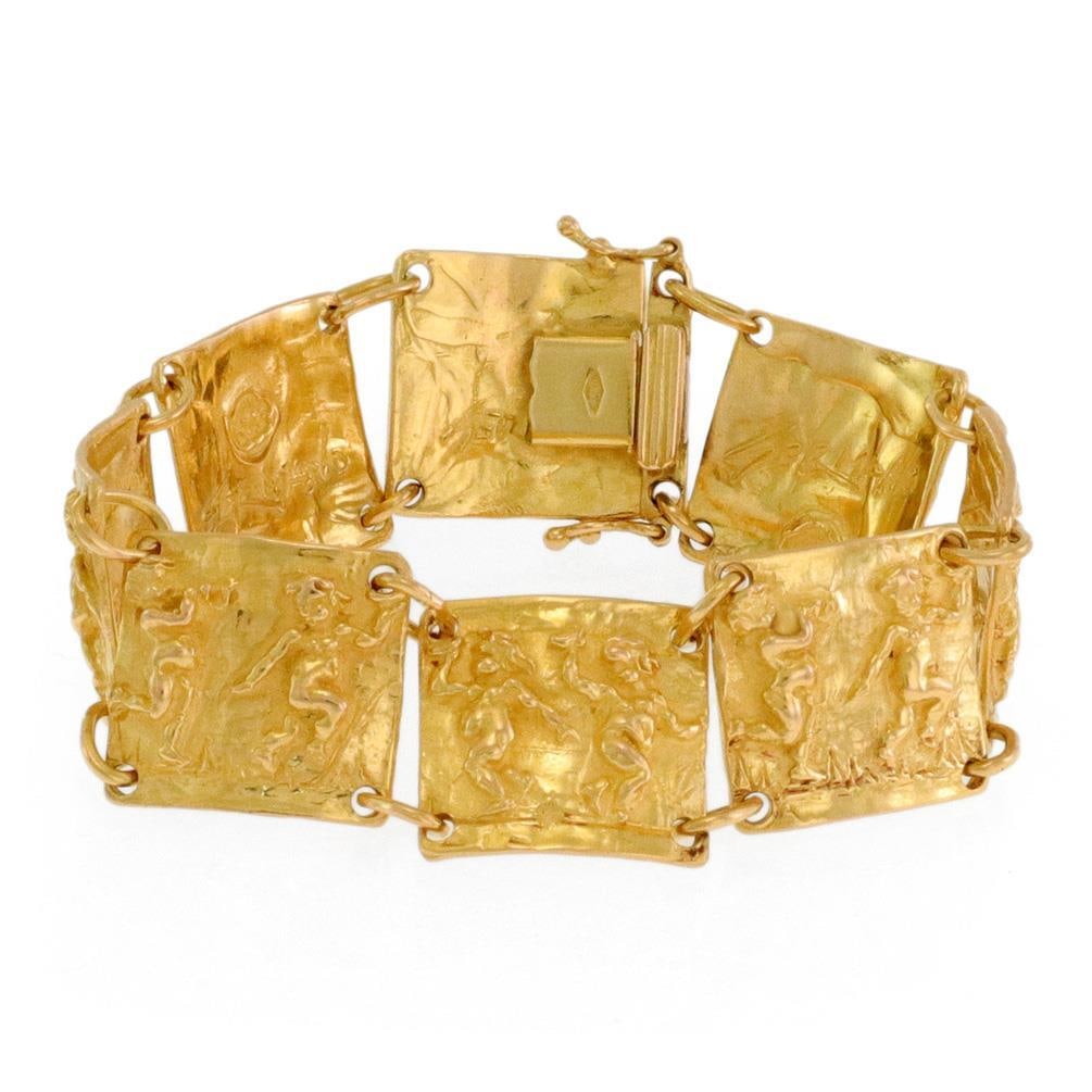 Nino D'Antonio Germano 18k Yellow Gold Cherub Link Bracelet 7in: Nino D'Antonio Germano 18k Yellow Gold Cherub Link Bracelet 7in This exquisite vintage bracelet, designed by Nino D'Antonio Germano in the 1960s, showcases a stunning craftsmanship in 18k yellow gold.