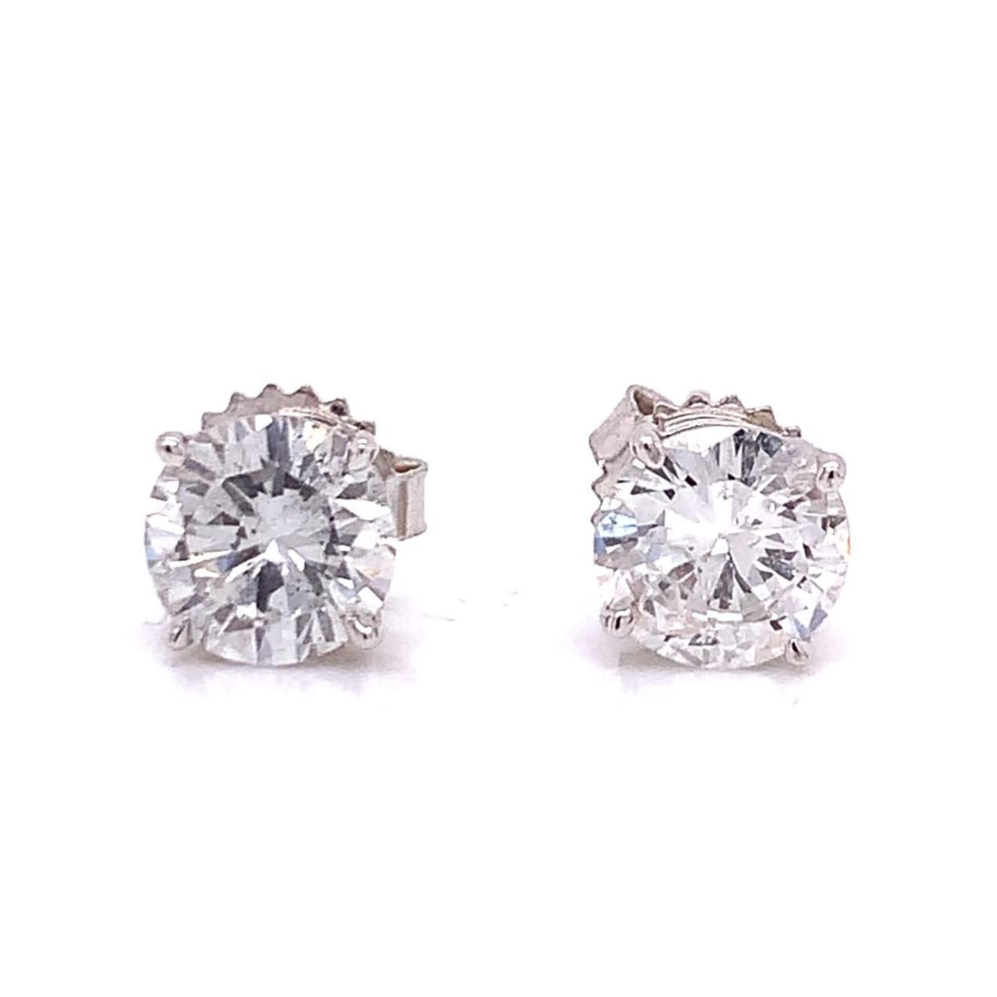 2.50 Ct E-F SI3 Diamond Stud Earrings Pre-Owned: 2.50 Ct E-F SI3 Diamond Stud Earrings Pre-Owned These stunning diamond studs feature two diamonds with a combined weight of approximately 2.50 Ct. They possess an E-F color grade and SI3 clarity, ensu