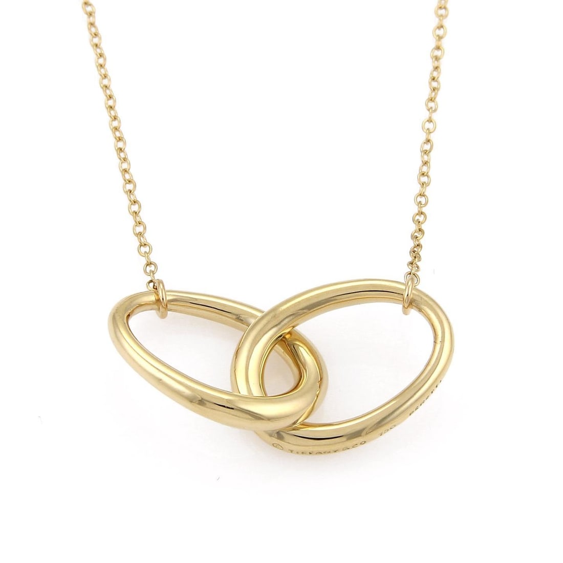 Tiffany & Co. Elsa Peretti 18k Yellow Gold Interlaced Oval Pendant Necklace: Tiffany & Co. Elsa Peretti 18k Yellow Gold Interlaced Oval Pendant Necklace This exquisite Tiffany & Co. pendant necklace, designed by Elsa Peretti, showcases a stunning double oval shape with interla