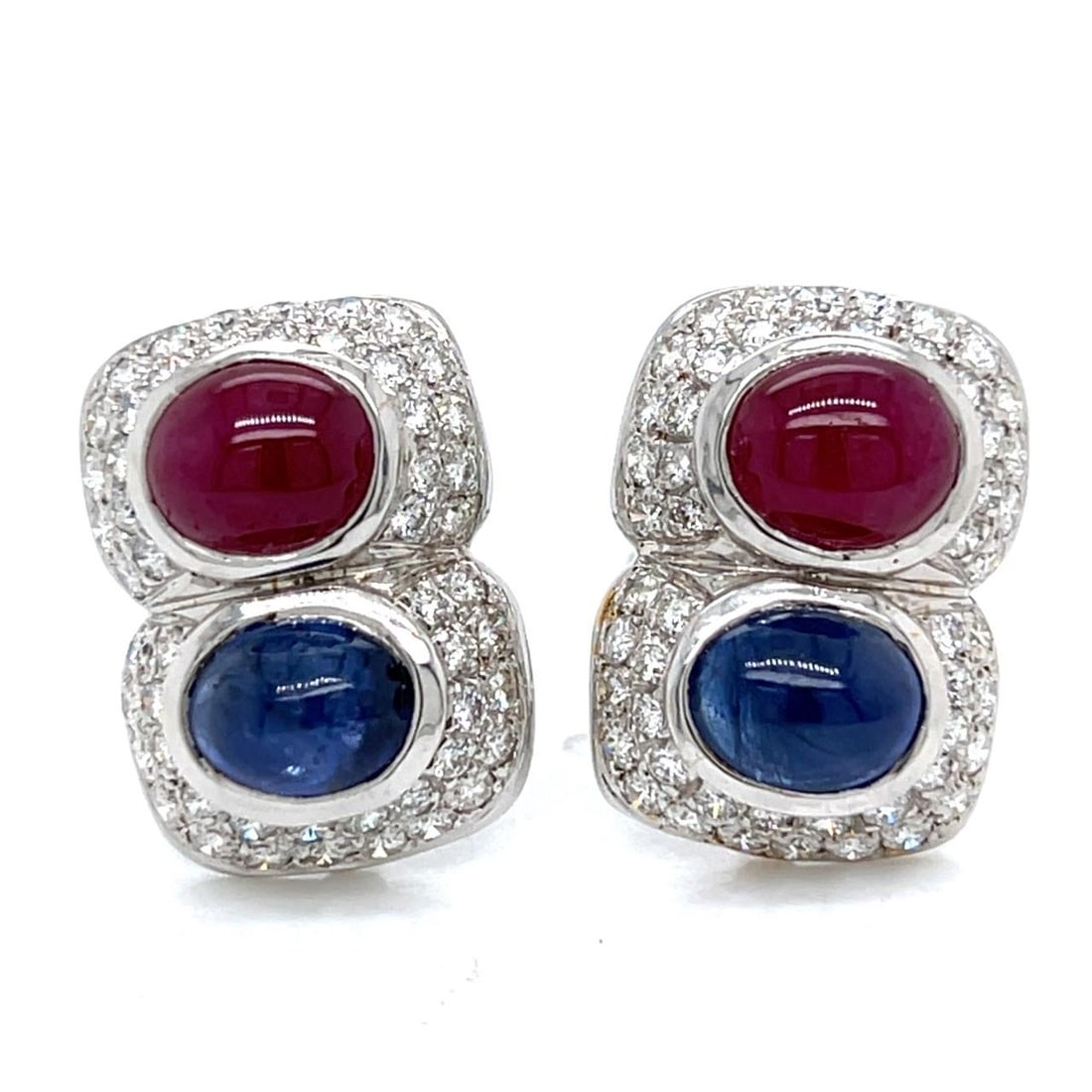 White Gold Earrings with Rubies Sapphires and Diamonds: White Gold Earrings with Rubies Sapphires and Diamonds These earrings are crafted from 18K white gold and feature two rubies totaling approximately 3.00 carats, two sapphires totaling approximately 3.