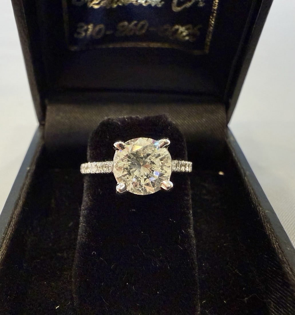 Exquisite 1.58ct 14K White Gold Diamond Ring Size 4.75: Exquisite 1.58ct 14K White Gold Diamond Ring Size 4.75 This exquisite 14K white gold diamond ring features a stunning brilliant cut center stone with a GI color and a total of approximately 1.58ct of
