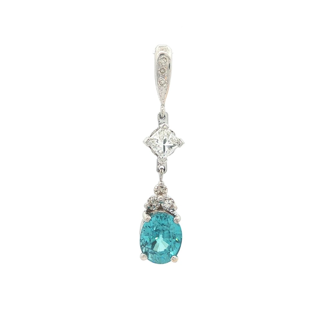 Blue Zircon and Diamond Y-Drop Pendant in White Gold: Blue Zircon and Diamond Y-Drop Pendant in White Gold This elegant drop dangle charm pendant features a vivid blue, oval brilliant cut natural zircon weighing approximately 1.90 carats, accented by sev