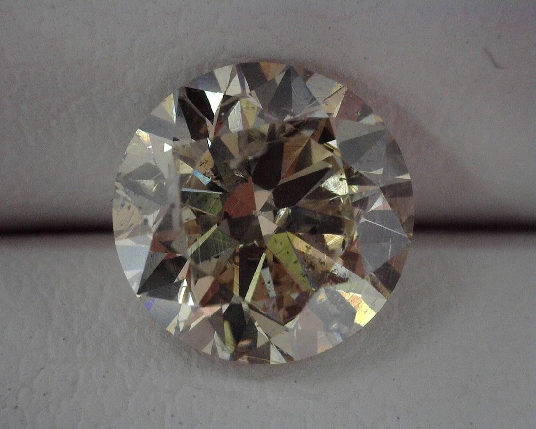 Loose Diamond - ROUND 1.32ct Brown I1: Loose Diamond - ROUND 1.32ct Brown I1 Source: Natural Shape: ROUND Carats: 1.32 Color: Brown Certification: OTHER The Diamond Depot Guarantee: All items in this auction are guaranteed to be 100% authe