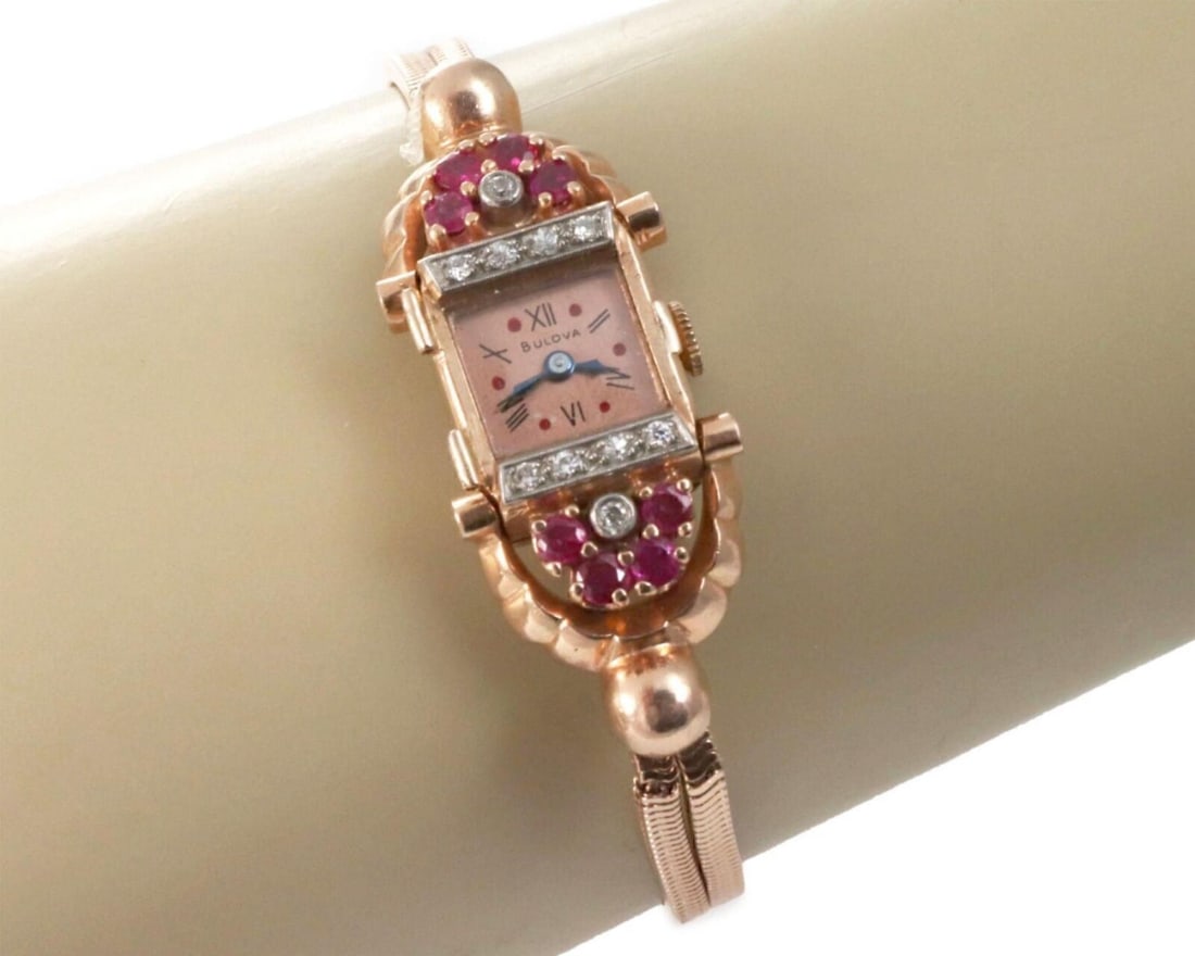 Bulova 14k Rose Gold Ladies Watch With Diamonds and Rubies Manual Wind Vintage: Bulova 14k Rose Gold Ladies Watch With Diamonds and Rubies Manual Wind Vintage This vintage Bulova ladies wristwatch features a 14k rose gold case and bracelet accented with sparkling diamonds and vib