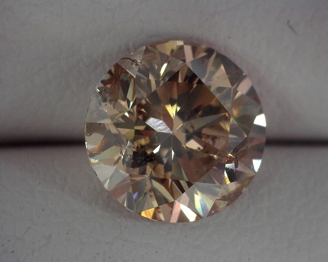 Loose Diamond - ROUND 1.31ct Brown I1: Loose Diamond - ROUND 1.31ct Brown I1 Source: Natural Shape: ROUND Carats: 1.31 Color: Brown Certification: OTHER The Diamond Depot Guarantee: All items in this auction are guaranteed to be 100% authe