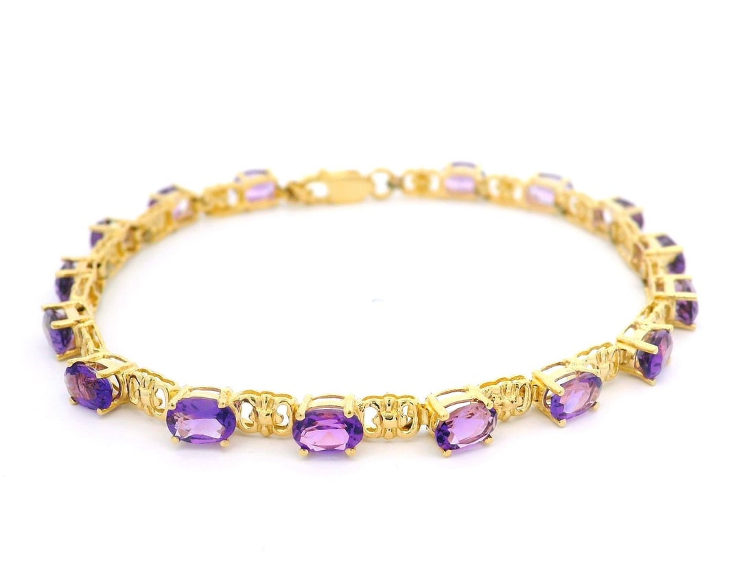 14k Yellow Gold Amethyst Open Link Bracelet 7.5 Inches: 14k Yellow Gold Amethyst Open Link Bracelet 7.5 Inches This stunning 14k Yellow Gold Oval Amethyst Alternating Open Link Line Bracelet features 16 natural genuine amethysts in a brilliant oval cut, pr