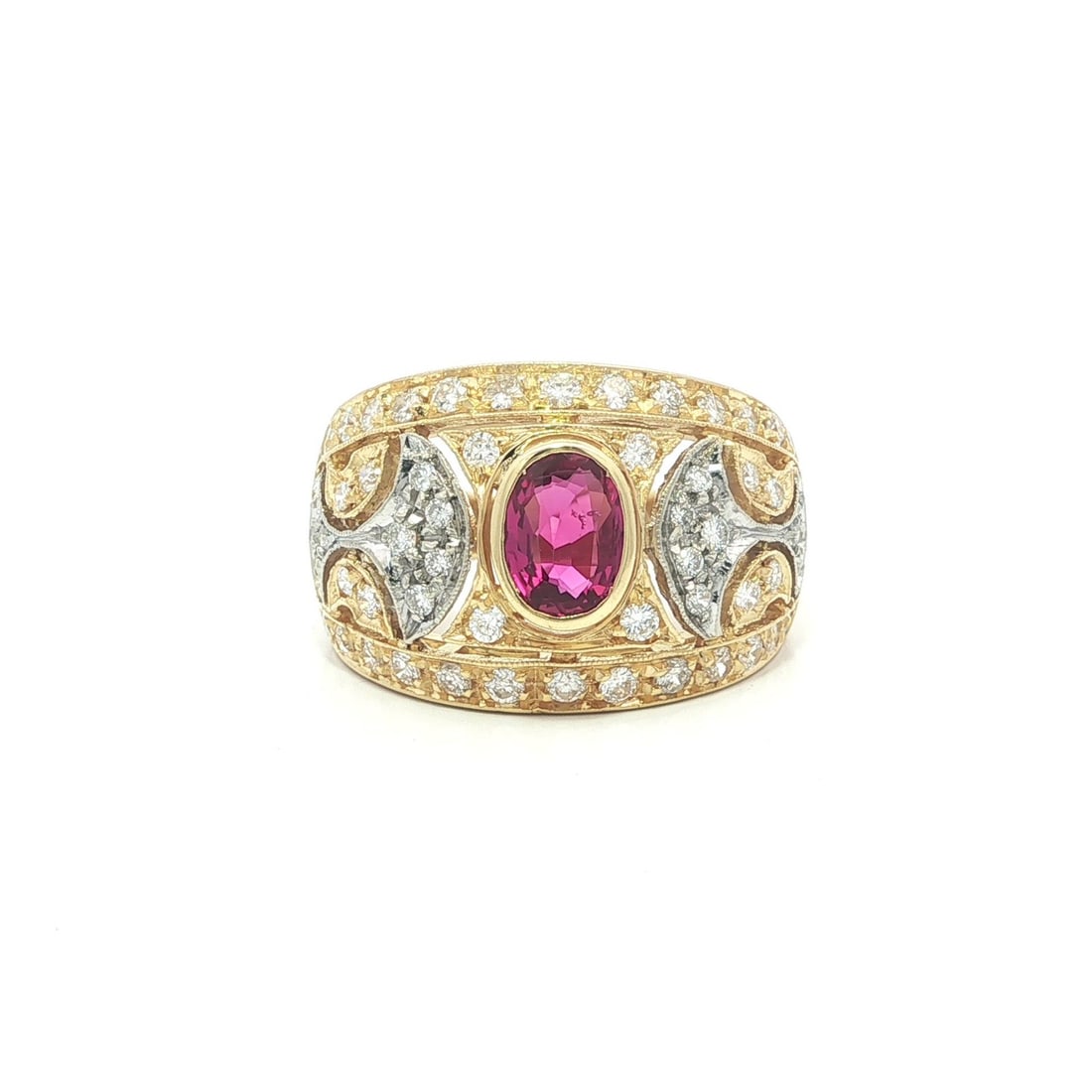 Wide 18k Gold Cigar Band Ring With Bezel Oval Ruby and Diamonds: Wide 18k Gold Cigar Band Ring With Bezel Oval Ruby and Diamonds This wide cigar band ring features an open work design crafted in 18k solid yellow gold with white gold accents. It showcases a bezel-se