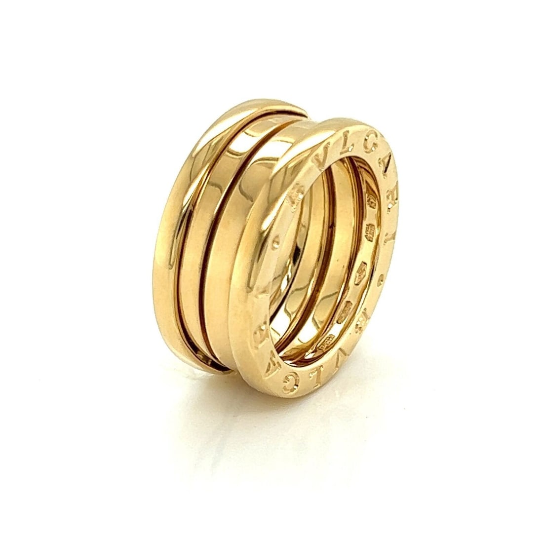 Bvlgari B.zero1 18k Yellow Gold Triple Band Ring Size EU 49 US 4.5: Bvlgari B.zero1 18k Yellow Gold Triple Band Ring Size EU 49 US 4.5 This authentic Bvlgari B.zero1 three-band ring is crafted in solid 18k yellow gold and features the collection's iconic triple spiral