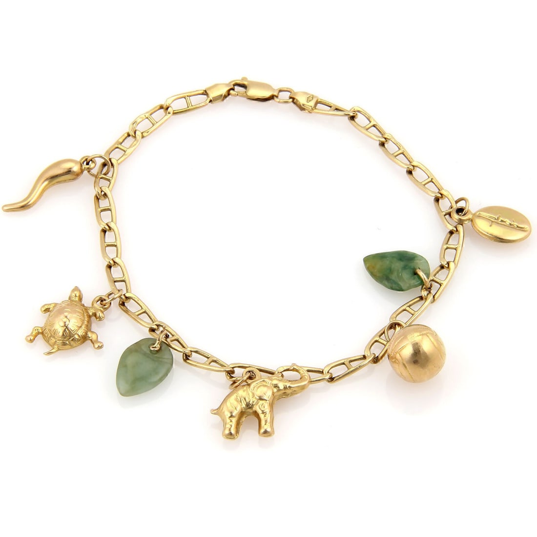 Vintage 14k Yellow Gold Jadeite Bracelet With Seven Unique Charms: Vintage 14k Yellow Gold Jadeite Bracelet With Seven Unique Charms This vintage charm link bracelet features seven assorted jadeite charms set in 14k yellow gold. The bracelet measures 7.5 inches in le
