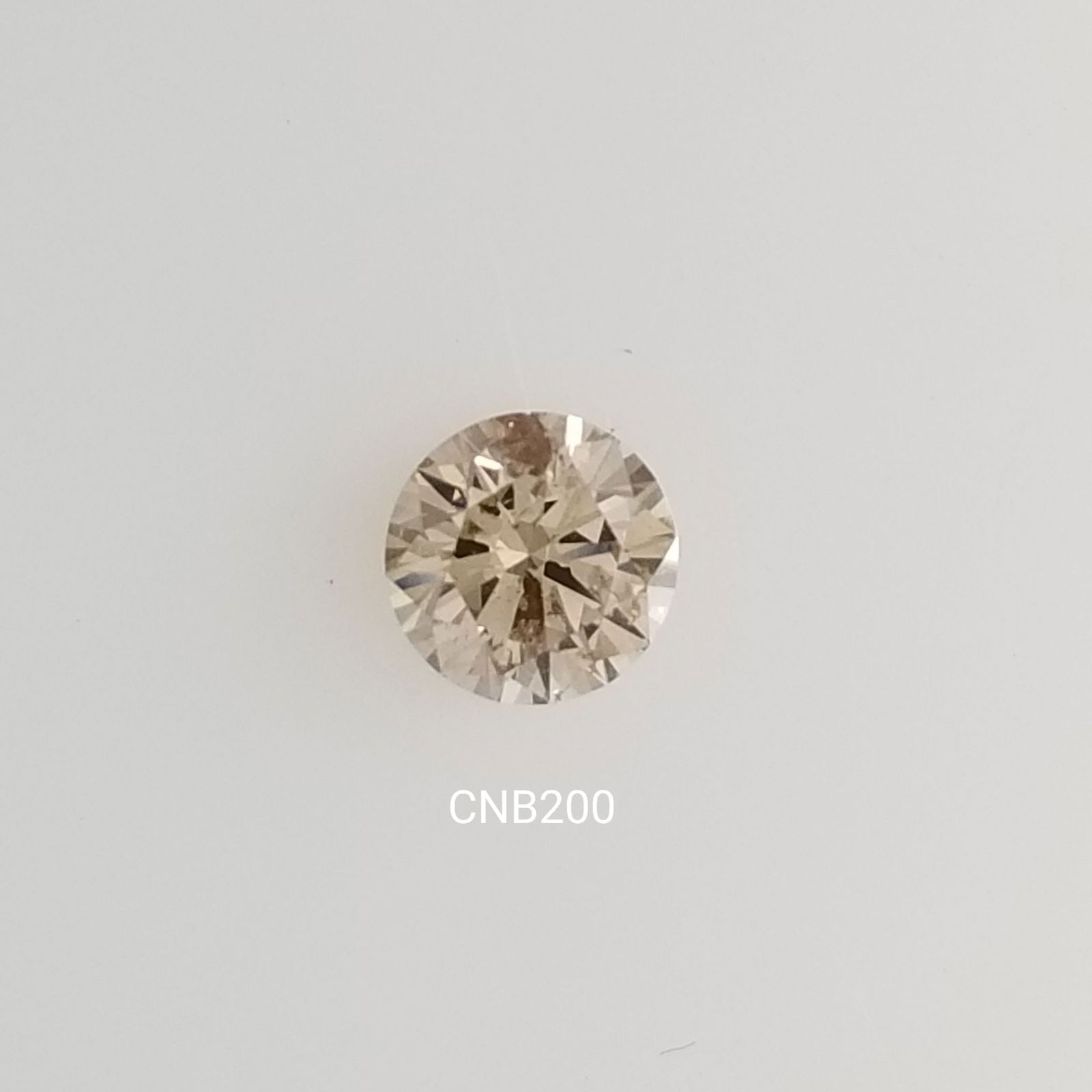 Loose Diamond - ROUND 0.67ct Fancy Light Brown SI2: Loose Diamond - ROUND 0.67ct Fancy Light Brown SI2 Source: Natural Shape: ROUND Carats: 0.67 Color: Fancy Light Brown Certification: NONE The Diamond Depot Guarantee: All items in this auction are gua