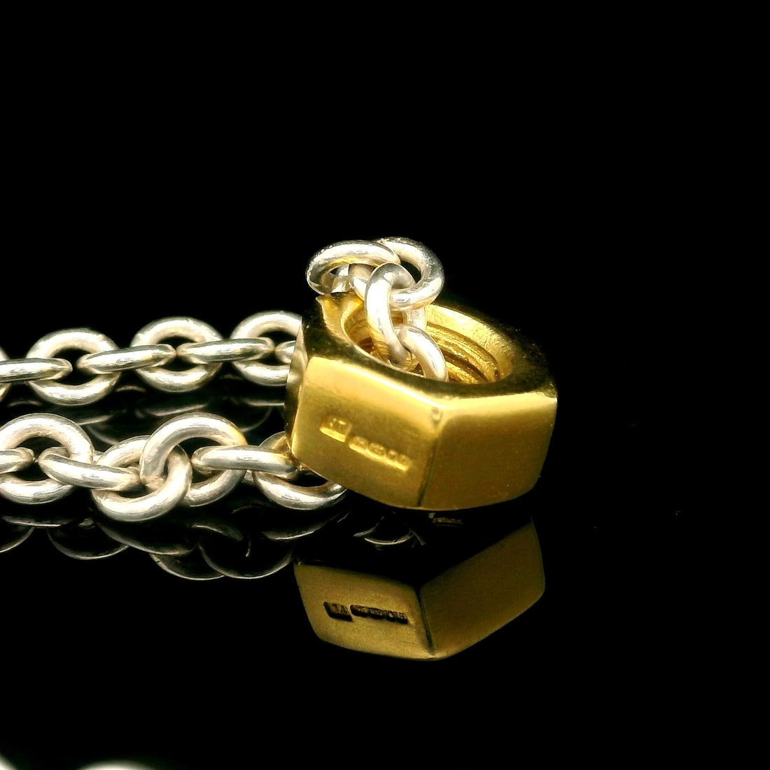Gold Plated M8 Hex Nuts on Sterling Silver Cable Chain Necklace 18": Gold Plated M8 Hex Nuts on Sterling Silver Cable Chain Necklace 18" This striking necklace features a unique design with English-made gold plated M8 hex nuts combined with a durable sterling silver ca