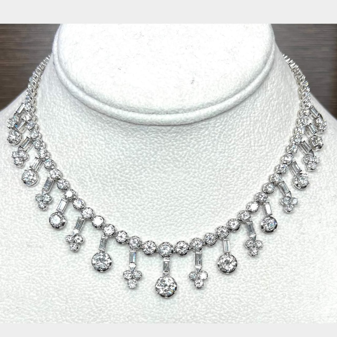 Art Deco Platinum 24.80 Ct Diamond Necklace with Baguette and Round Diamonds: Art Deco Platinum 24.80 Ct Diamond Necklace with Baguette and Round Diamonds This exquisite Art Deco necklace is crafted in platinum and features a stunning total diamond weight of 24.80 ct. It is ele