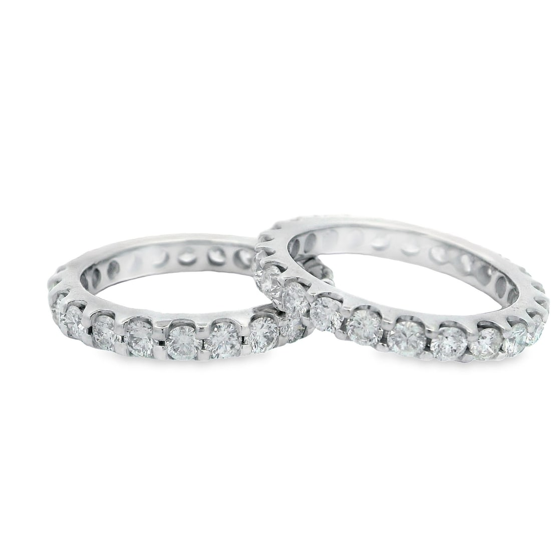 14k White Gold 3.25ctw Diamond Eternity Bands Pair: 14k White Gold 3.25ctw Diamond Eternity Bands Pair This stunning pair of wedding and anniversary bands features a total of 3.25 carats of fiery round brilliant cut diamonds, expertly prong set in soli