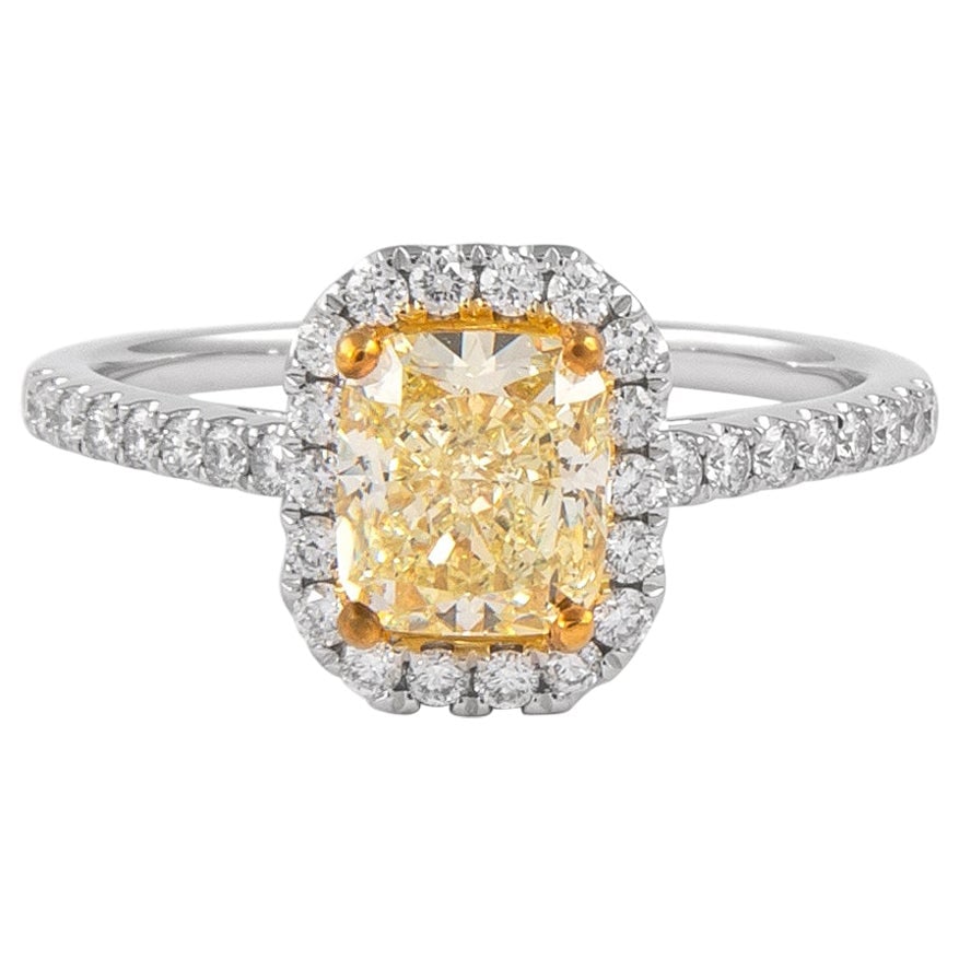 GIA 1.23ct Fancy Light Yellow Diamond Halo Ring 18k Gold: GIA 1.23ct Fancy Light Yellow Diamond Halo Ring 18k Gold Experience luxury with this stunning contemporary halo ring featuring a GIA certified 1.23 ct Fancy Light Yellow diamond. Set in a beautiful tw
