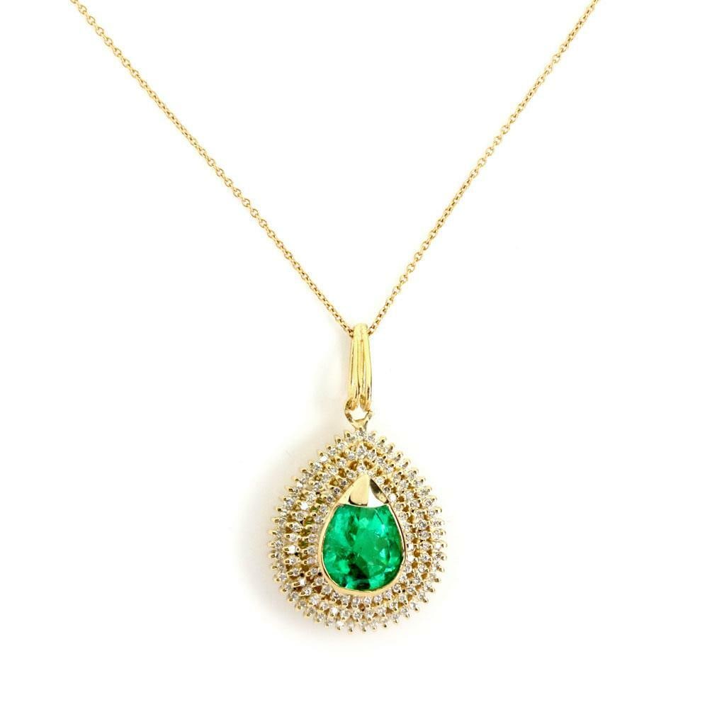 Estate 18k Yellow Gold Diamond Emerald Pendant Necklace: Estate 18k Yellow Gold Diamond Emerald Pendant Necklace This exquisite estate pendant necklace is crafted from 18k yellow gold and features a stunning large pear-shaped pendant. The pendant is adorned