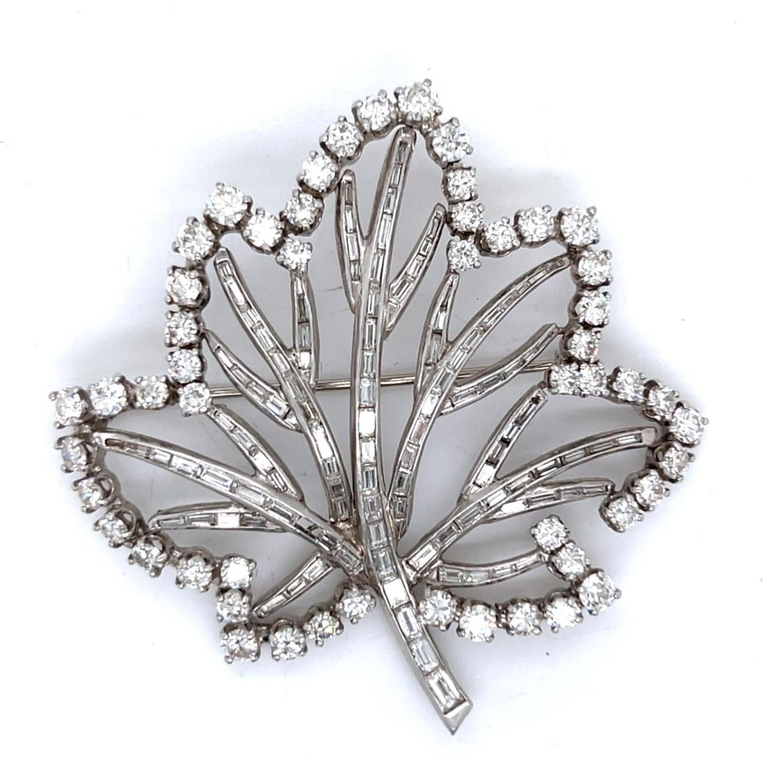 Art Deco Platinum Maple Leaf Brooch 11.00 Ct Diamonds: Art Deco Platinum Maple Leaf Brooch 11.00 Ct Diamonds This exquisite Art Deco brooch showcases a stunning maple leaf design, crafted in luxurious platinum. It features a total of 52 Old Mine Diamonds,